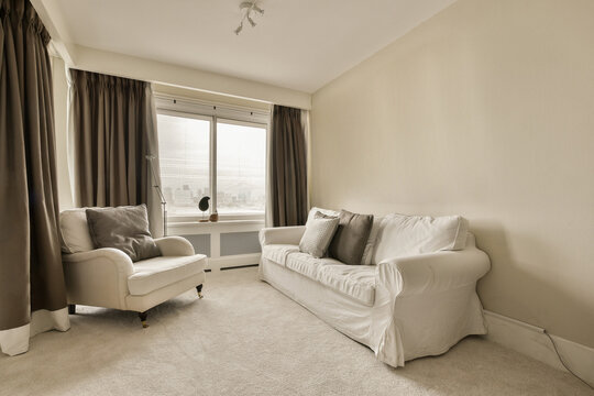 living room with armchair and sofa at modern home
