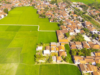 Aerial Photography. Aerial Drone view of landscape view of residential district on the edge of rice...