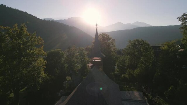 Aerial drone view of old wooden church with crucifix, Romania, Transylvania. 