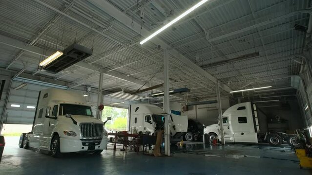 the truck in the workshop garage for repairs. wide shot footage