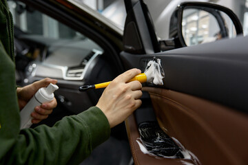 Automotive fittings cleaning inside car process closeup