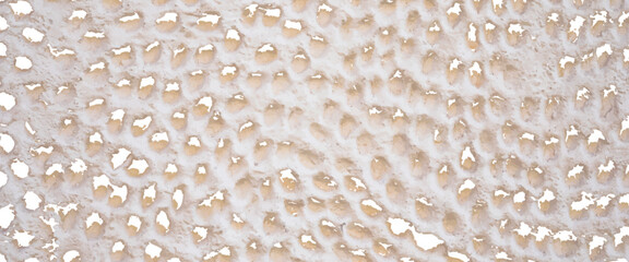 Background grey cement wall , brown stone. Mosaic, ceramic stone.