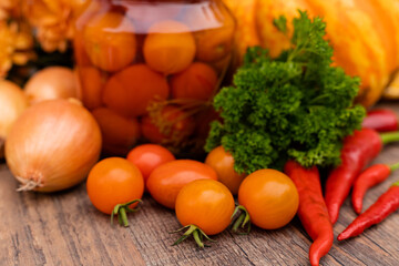 Canned cherry tomatoes. Vegetables for preservation on the table in the kitchen