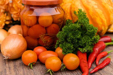 Canned cherry tomatoes. Vegetables for preservation on the table in the kitchen