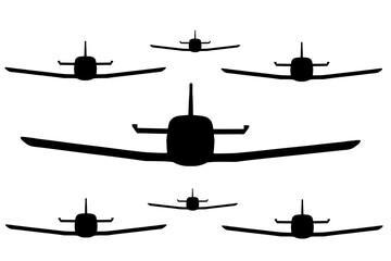 Obraz premium Kamikaze plane jet fighter in formation vector silhouette illustration isolated. Squadron aircraft in battle attack position. Swarm of attacking drones. Robot remote control drone on sky.