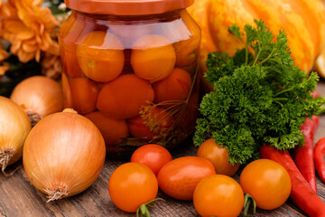 Canned cherry tomatoes. Vegetables for preservation on the table in the kitchen