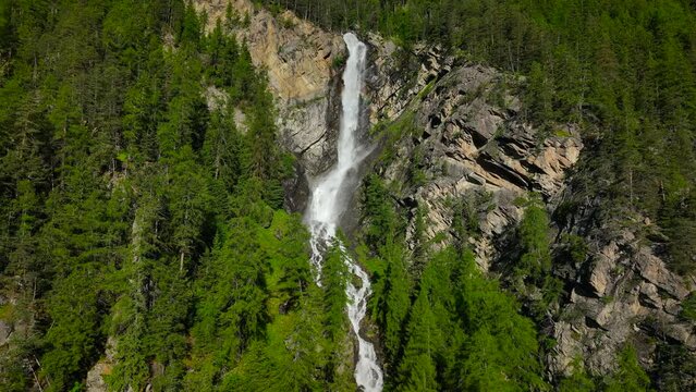 Lehner Wasserfall waterfall in the Otztal valley in Tyrol Austria during a beautiful springtime day in the Alps.