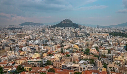 Landscape panoramic exposure of Athens urban cityscape showing the city center including some of the highlights namely the historical buildings.