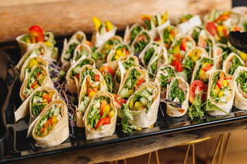 Set of vegetable roll snacks at the wedding event. - Powered by Adobe