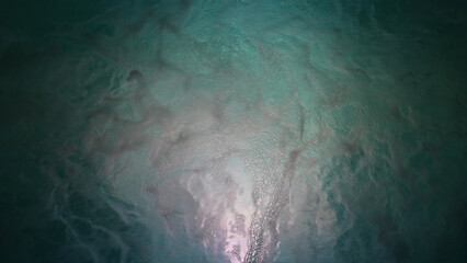 Night shot with copy space of led illuminated jacuzzi pool full of healthy bubbles of water...