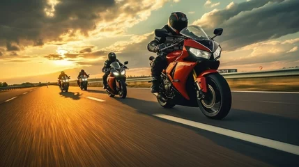 Gordijnen A group of motorcyclists ride sports bikes at fast speeds on an empty road against a beautiful cloudy sky. © somchai20162516