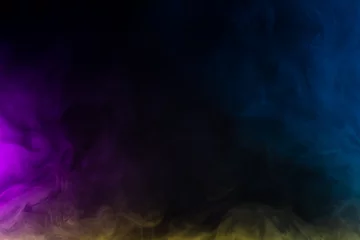 Gordijnen Blurred photo texture of colored smoke on a black background. © vfhnb12