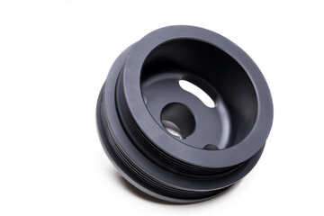 a new pulley for a car on an engine made on a multi-manual CNC machine on a white background