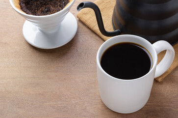a cup of coffee brewed with pour over method, close up view. alternative healthy beverage concept.