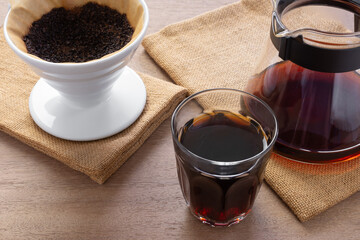 a cup of coffee brewed with pour over method, close up view. alternative healthy beverage concept.