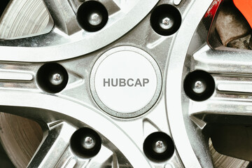 Close up a mini hubcap cover of car wheel, hubcap cover in a wheel hub. Automotive parts concept