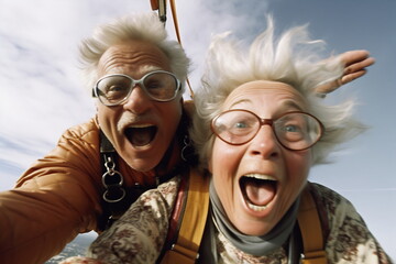 Selfie skydiving tandem of an elderly couple