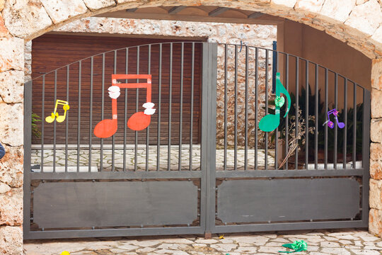 Metall gate decorated with some musical notes on "Costitx en Flor" (Costitx in bloom) Flower Fair, Majorca, Spain