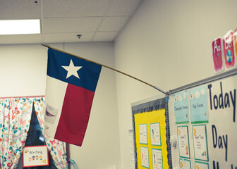Cute classroom bulletin board and proudly display of Texas flag in pre-kindergarten classroom,...