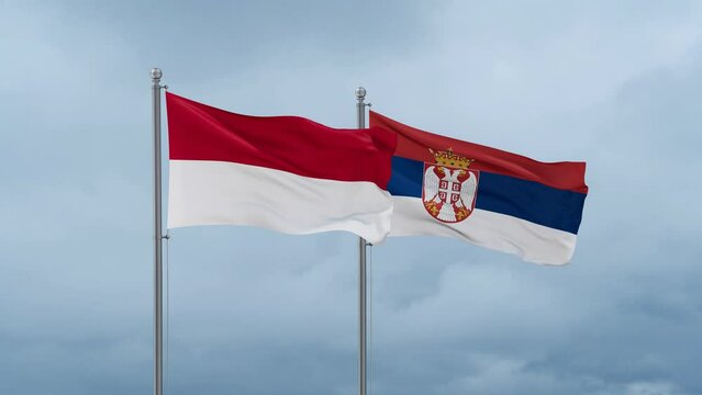 Republic of Serbia and Indonesia flag waving together on cloudy sky, endless seamless loop, two country cooperation concept