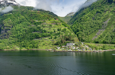 Beautiful landscape with houses in Geiranger fjord, Norway - 657081674