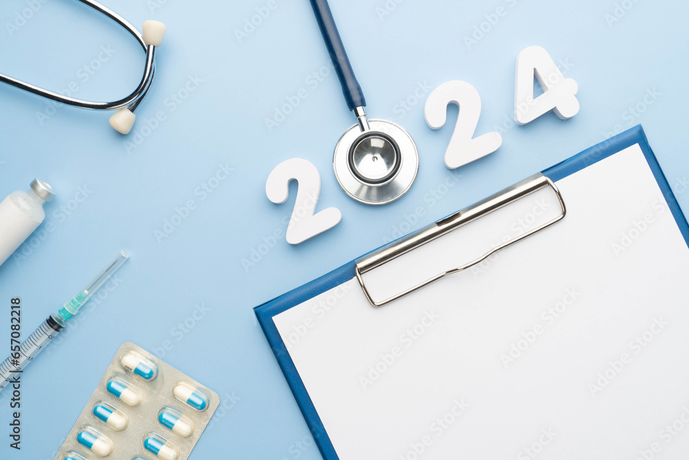 Wall mural 2024 happy new year banner for health care and medical concept. stethoscope with doctor order chart,