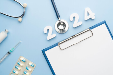 2024 Happy New Year banner for health care and medical concept. Stethoscope with doctor order...