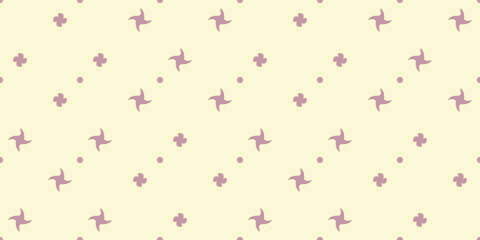 Polka dots made of swirling shapes, four-pointed flowers, and dots.