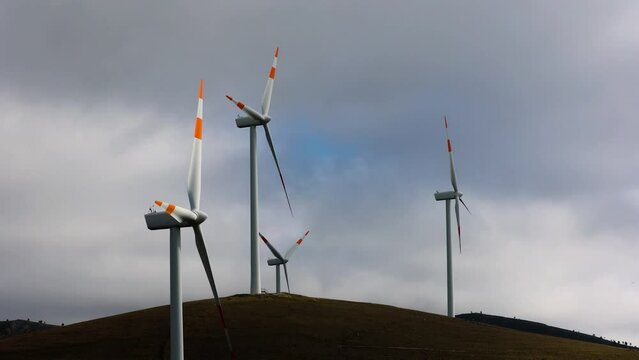 A wind farm or wind park, is a group of wind turbines used to produce electricity. This particular wind farm is located on the mountains of Italy and it allows to realize clean energy. enviromental
