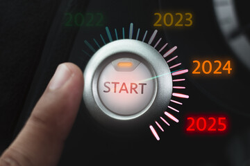 Start button on the car's dashboard with numbers 2024 and 2025.