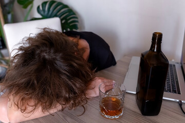 Drunk intoxicated woman sleeping near whiskey glass, female heavy drinker alcoholic passed out lying asleep after booze, alcoholism problem, alcohol addiction concept. 