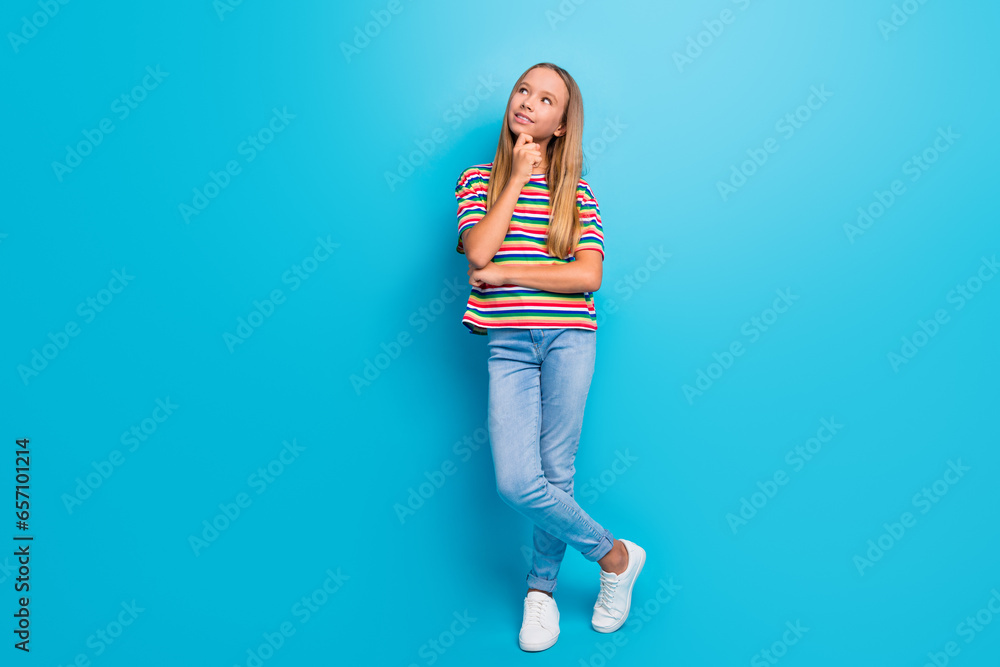 Sticker full size photo of thoughtful teen girl wear colorful t-shirt denim pants look at offer empty space 