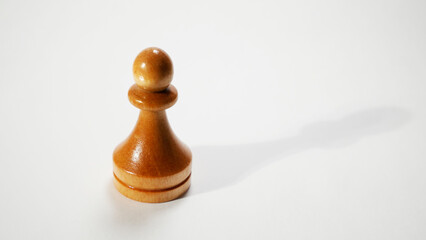 a lone pawn on a white background