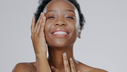 Touch face, skincare and beauty of black woman in studio isolated on gray background for...
