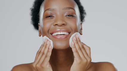 Woman, model and cotton pad on face with skincare, toner and happiness in advertisement, cosmetics...