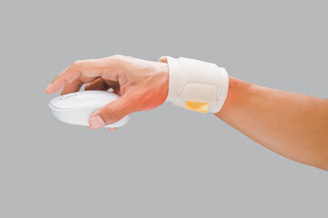 The man's arm using a wrist restraint to prevent wrist pain.
