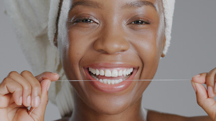 Portrait, black woman with floss for teeth and dental, health and wellness with beauty on grey...