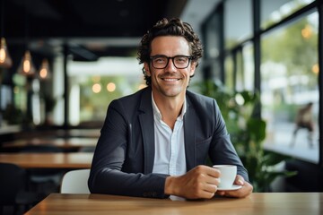 Professional Businessman Posing with Coffee Mug