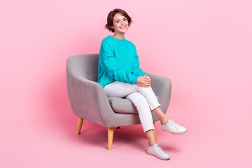 Fototapeta na wymiar Full length photo of cheerful lovely lady office worker recruiter sitting interview comfy chair isolated on pink color background