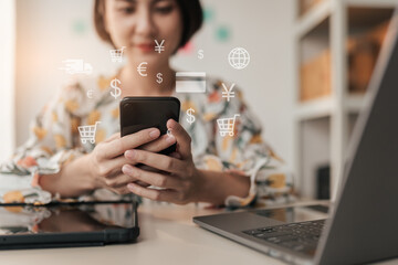 Selective focus hand, Asian woman customer using smartphone to shopping online. Business e-commerce online marketing concept.