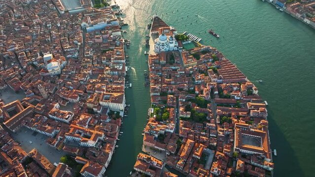 Venice skyline aerial, highlighting Basilica di Santa Maria della Salute, Grand Canal, Punta della Dogana triangular shape architecture, in the heart of Venetian Lagoon, Italy