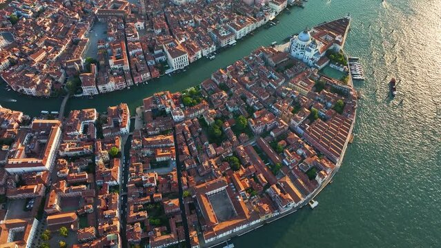 Aerial panorama of Venice, capturing Basilica, Grand Canal, Punta della Dogana triangular shape architecture, in the heart of Venetian Lagoon, Italy