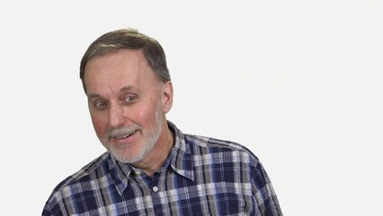 Portrait of a senior old man looking curiously. Prank and fun. Isolated on white.