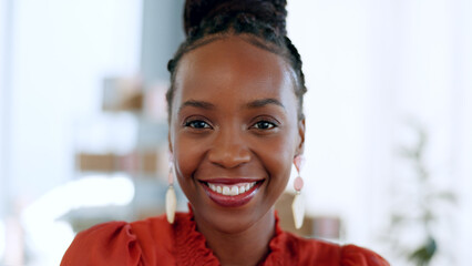Portrait, happy and a black woman employee closeup in the office of her small business boutique....