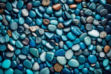 Aqua Abundance: Teal Ocean Pebbles Under a Blue Sky