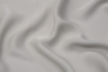 Elegant light gray fabric backgrounds. Metallic grey color of shiny textile, soft silver texture....