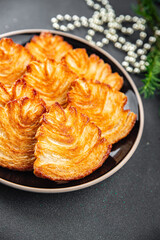 christmas cookie puff pastry biscuits sweet dessert puff sfoglie holiday treat new year and christmas  meal food snack on the table copy space food background rustic top view