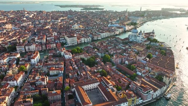 Venice from the sky, showcasing Basilica, Grand Canal, Punta della Dogana triangular shape architecture, in the heart of Venetian Lagoon, Italy