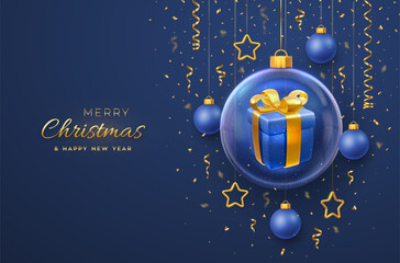 Merry christmas greeting card. Gift box with golden bow in a glass bauble. Christmas blue background with hanging gold stars and balls. Holiday Xmas, New Year banner, flyer. Vector Illustration.