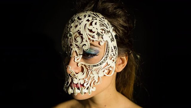 A woman with Venetian skull mask